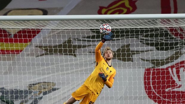 Liverpool's goalkeeper Caoimhin Kelleher makes a save during the Champions League group D soccer match between Liverpool and Ajax at Anfield stadium in Liverpool, England, Tuesday, Dec. 1, 2020. (Peter Byrne/Pool via AP)