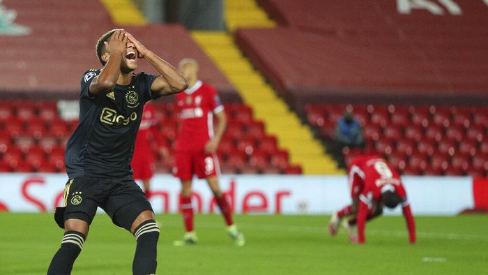 Liverpool vs Ajax Ajaxs David Neres reacts after missing a chance to score during the Champions League group D soccer match between Liverpool and Ajax at Anfield stadium in Liverpool, England, Tuesday, Dec. 1, 2020. (Peter Byrne/Pool via AP)