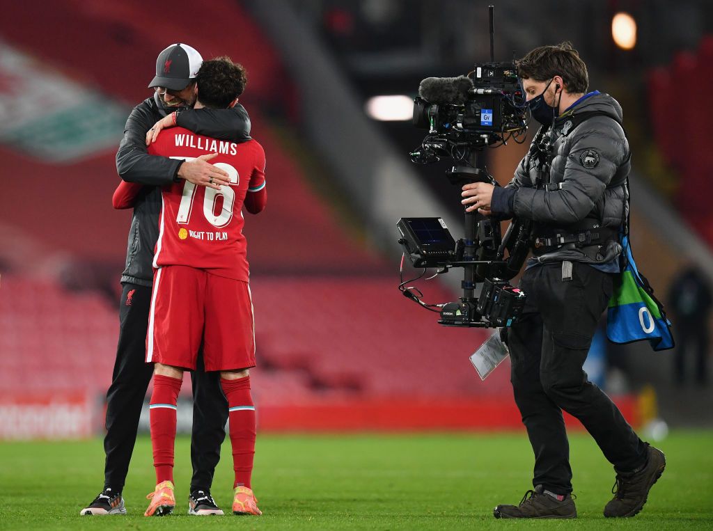 LIVERPOOL, ENGLAND - DECEMBER 1: Liverpool's Curtis Jones celebrates with teammate Neco Williams after scoring his team's first goal during the UEFA Champions League Group D stage match between Liverpool FC and Ajax Amsterdam at Anfield on December 1, 2020 in Liverpool, England.  Sports stadiums across the UK remain under strict restrictions due to the coronavirus pandemic, as the government's social distancing laws prohibit fans within venues, causing games to be played behind closed doors.  (Photo by Michael Regan / Getty Images)