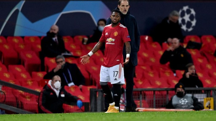 MANCHESTER, ENGLAND - DECEMBER 02: Fred of Manchester United gestures from the edge of the pitch after being sent off during the UEFA Champions League Group H stage match between Manchester United and Paris Saint-Germain at Old Trafford on December 02, 2020 in Manchester, England. Sporting stadiums around the UK remain under strict restrictions due to the Coronavirus Pandemic as Government social distancing laws prohibit fans inside venues resulting in games being played behind closed doors. (Photo by Laurence Griffiths/Getty Images)