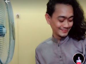 Lagi Asyik Makan, Pria Gondrong Ini Baper Sama Kipas Angin