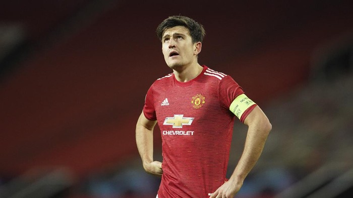 Manchester Uniteds Harry Maguire reacts during a Group H Champions League soccer match between Manchester United and Paris Saint Germain at the Old Trafford stadium in Manchester, England, Wednesday, Dec. 2, 2020. (AP Photo/Dave Thompson)