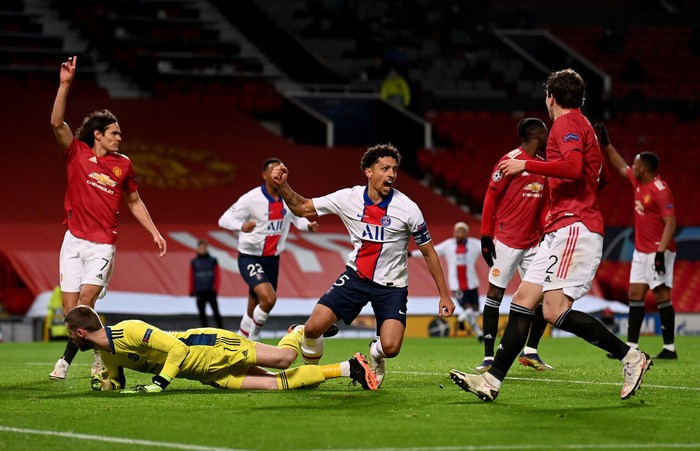 MANCHESTER, ENGLAND - DECEMBER 02: Marquinhos of Paris Saint-Germain celebrates after scoring their sides second goal during the UEFA Champions League Group H stage match between Manchester United and Paris Saint-Germain at Old Trafford on December 02, 2020 in Manchester, England. Sporting stadiums around the UK remain under strict restrictions due to the Coronavirus Pandemic as Government social distancing laws prohibit fans inside venues resulting in games being played behind closed doors. (Photo by Laurence Griffiths/Getty Images)