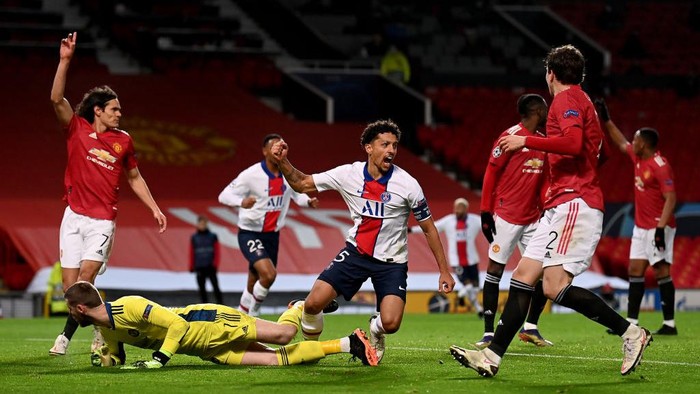 MANCHESTER, ENGLAND - DECEMBER 02: Marquinhos of Paris Saint-Germain celebrates after scoring their sides second goal during the UEFA Champions League Group H stage match between Manchester United and Paris Saint-Germain at Old Trafford on December 02, 2020 in Manchester, England. Sporting stadiums around the UK remain under strict restrictions due to the Coronavirus Pandemic as Government social distancing laws prohibit fans inside venues resulting in games being played behind closed doors. (Photo by Laurence Griffiths/Getty Images)