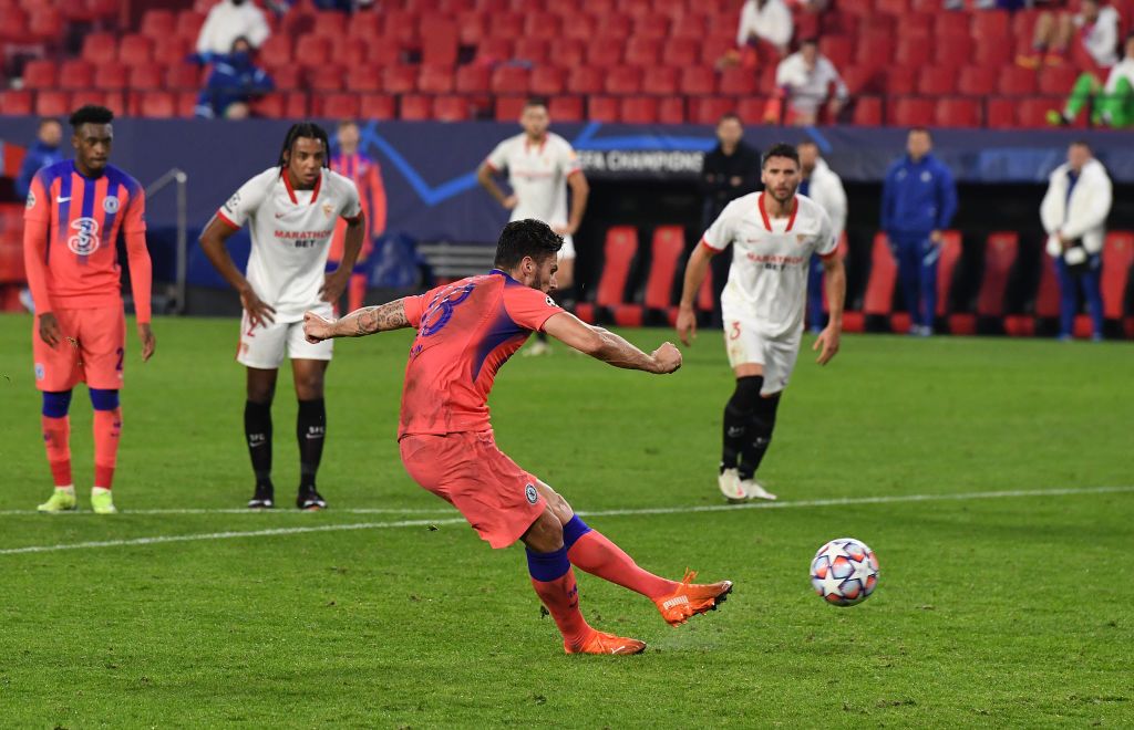 SEVILLE, SPAIN - DECEMBER 02: Olivier Giroud of Chelsea scores their sides fourth goal from the penalty spot during the UEFA Champions League Group E stage match between FC Sevilla and Chelsea FC at Estadio Ramon Sanchez Pizjuan on December 02, 2020 in Seville, Spain. Sporting stadiums around Spain remain under strict restrictions due to the Coronavirus Pandemic as Government social distancing laws prohibit fans inside venues resulting in games being played behind closed doors. (Photo by David Ramos/Getty Images)