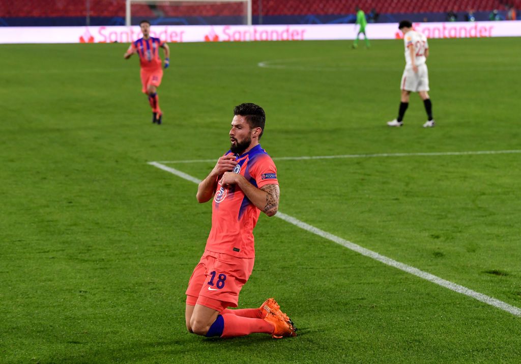 SEVILLE, SPAIN - DECEMBER 02: Olivier Giroud of Chelsea celebrates after scoring their sides second goal during the UEFA Champions League Group E stage match between FC Sevilla and Chelsea FC at Estadio Ramon Sanchez Pizjuan on December 02, 2020 in Seville, Spain. Sporting stadiums around Spain remain under strict restrictions due to the Coronavirus Pandemic as Government social distancing laws prohibit fans inside venues resulting in games being played behind closed doors. (Photo by David Ramos/Getty Images)