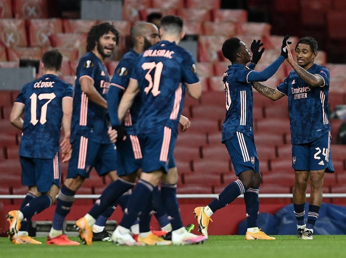 LONDON, ENGLAND - DECEMBER 03: Eddie Nketiah of Arsenal celebrates with Reiss Nelson after scoring their teams third goal during the UEFA Europa League Group B stage match between Arsenal FC and Rapid Wien at Emirates Stadium on December 03, 2020 in London, England. A limited number of fans are welcomed back to stadiums to watch elite football across England. This was following easing of restrictions on spectators in tiers one and two areas only. (Photo by Mike Hewitt/Getty Images)