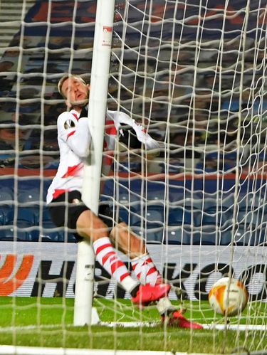 Standard Liege's Croatian forward Duje Cop collides with the post after scoring their second goal during the UEFA Europa League 1st round Group D football match between Rangers and Standard Liege at the Ibrox Stadium in Glasgow on December 3, 2020. (Photo by ANDY BUCHANAN / POOL / AFP)