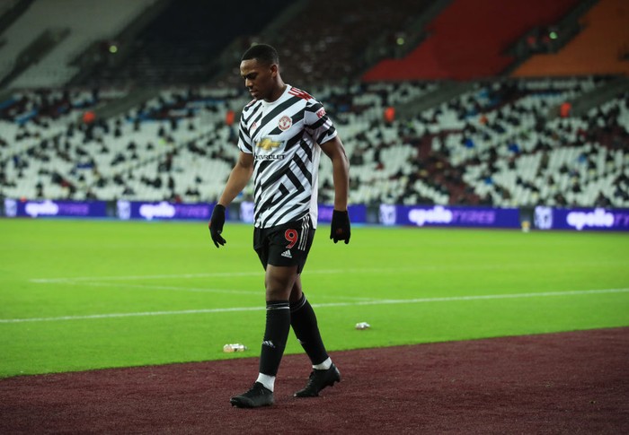 LONDON, ENGLAND - DECEMBER 05: Anthony Martial of Manchester United goes off injured during the Premier League match between West Ham United and Manchester United at London Stadium on December 05, 2020 in London, England. A limited number of fans are welcomed back to stadiums to watch elite football across England. This was following easing of restrictions on spectators in tiers one and two areas only. (Photo by Adam Davy - Pool/Getty Images)
