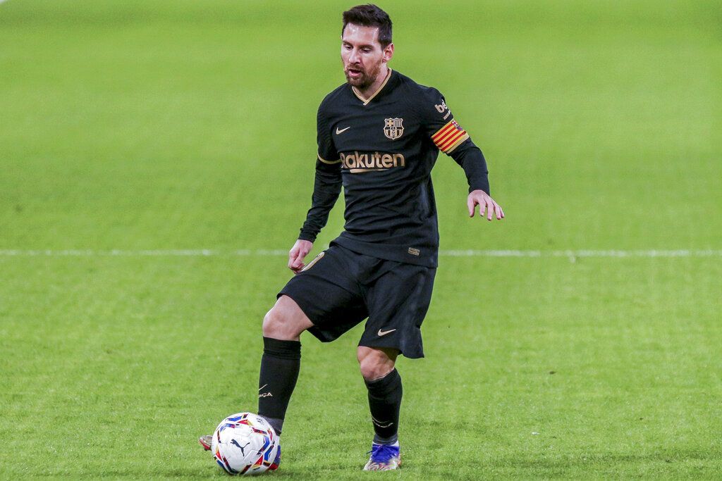 Barcelona's Lionel Messi controls the ball during the Spanish La Liga soccer match between Cadiz and FC Barcelona at the Ramon Carranza stadium in Cadiz, Spain, Saturday Dec. 5, 2020. (AP Photo/Alvaro Rivero)