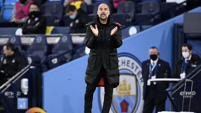 MANCHESTER, ENGLAND - DECEMBER 05: Pep Guardiola, Manager of Manchester City reacts during the Premier League match between Manchester City and Fulham at Etihad Stadium on December 05, 2020 in Manchester, England. The match will be played without fans, behind closed doors as a Covid-19 precaution. (Photo by Peter Powell - Pool/Getty Images)