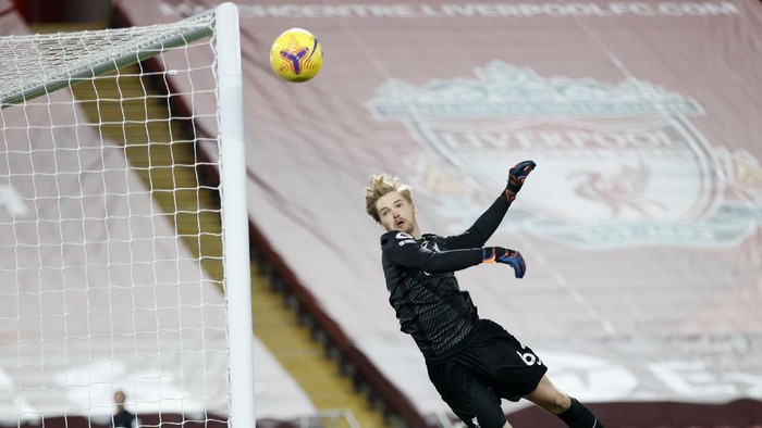 Liverpool's goalkeeper Caoimhin Kelleher leaps for the ball during the English Premier League soccer match between Liverpool and Wolverhampton Wanderers at Anfield Stadium, Liverpool, England, Sunday, Dec. 6, 2020. (Clive Brunskill/Pool via AP)