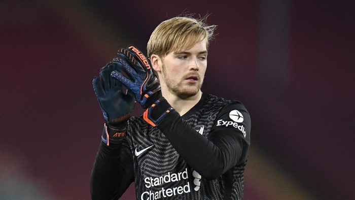 LIVERPOOL, ENGLAND - DECEMBER 06: Caoimhin Kelleher of Liverpool applauds fans following the Premier League match between Liverpool and Wolverhampton Wanderers at Anfield on December 06, 2020 in Liverpool, England. A limited number of fans (2000) are welcomed back to stadiums to watch elite football across England. This was following easing of restrictions on spectators in tiers one and two areas only. (Photo by Peter Powell - Pool/Getty Images)