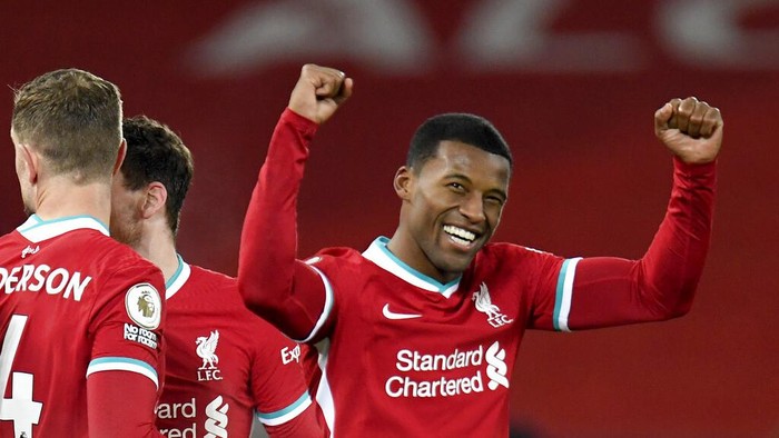 Liverpools Georginio Wijnaldum celebrates after scoring his sides second goal during the English Premier League soccer match between Liverpool and Wolverhampton Wanderers at Anfield Stadium, Liverpool, England, Sunday, Dec. 6, 2020. (Peter Powell/Pool via AP)