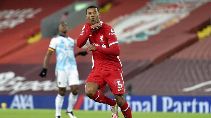 Liverpools Georginio Wijnaldum celebrates after scoring his sides second goal during the English Premier League soccer match between Liverpool and Wolverhampton Wanderers at Anfield Stadium, Liverpool, England, Sunday, Dec. 6, 2020. (Peter Powell/Pool via AP)