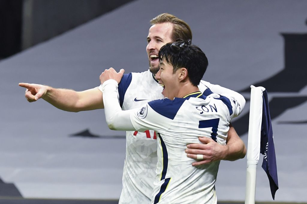 Tottenham's Son Heung-min, right, who scored his side's first goal, celebrates with Tottenham's Harry Kane, left, who scored his side's second goal, during the English Premier League soccer match between Tottenham Hotspur and Arsenal at Tottenham Hotspur Stadium in London, England, Sunday, Dec. 6, 2020. (Glyn Kirk/Pool via AP)