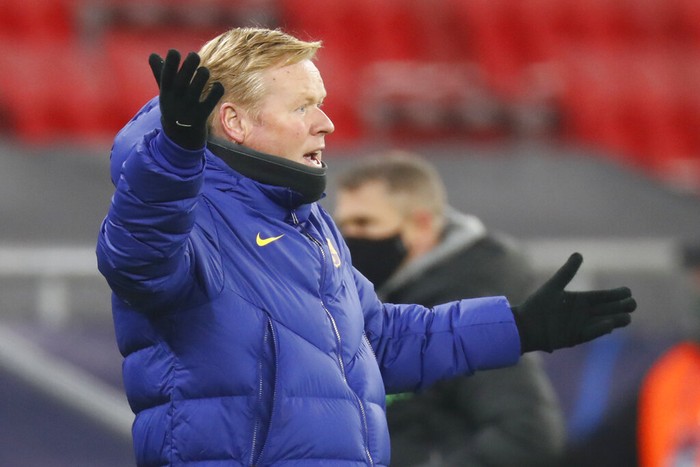 Barcelonas head coach Ronald Koeman reacts during the Champions League group G soccer match between Ferencvaros and Barcelona at the Ferenc Puskas stadium in Budapest, Hungary, Wednesday, Dec. 2, 2020. (AP Photo/Laszlo Balogh)