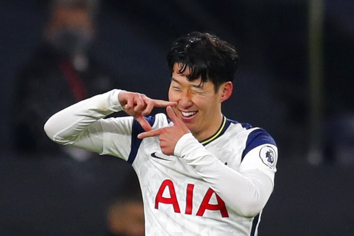 Tottenhams Son Heung-min celebrates scoring his sides first goal during the English Premier League soccer match between Tottenham Hotspur and Arsenal at Tottenham Hotspur Stadium in London, England, Sunday, Dec. 6, 2020. (Catherine Ivill/Pool via AP)