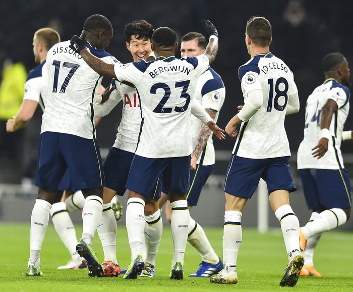 Tottenham Hotspur Tottenham players celebrate with Son Heung-min, third left, who scored his side's first goal during the English Premier League soccer match between Tottenham Hotspur and Arsenal at Tottenham Hotspur Stadium in London, England, Sunday, Dec. 6, 2020. (Glyn Kirk/Pool via AP)