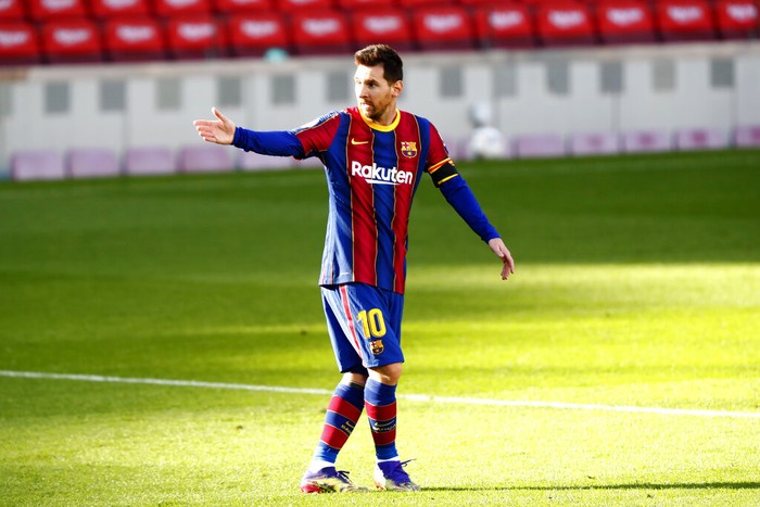 Barcelonas Lionel Messi gestures during the Spanish La Liga soccer match between FC Barcelona and Osasuna at the Camp Nou stadium in Barcelona, Spain, Sunday, Nov. 29, 2020. (AP Photo/Joan Monfort)