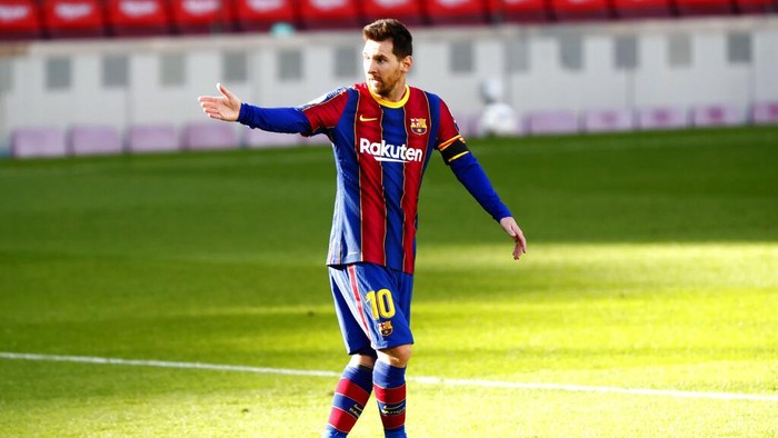 Barcelonas Lionel Messi gestures during the Spanish La Liga soccer match between FC Barcelona and Osasuna at the Camp Nou stadium in Barcelona, Spain, Sunday, Nov. 29, 2020. (AP Photo/Joan Monfort)