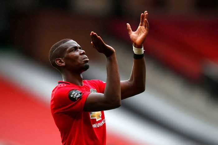 MANCHESTER, ENGLAND - JULY 04: Paul Pogba of Manchester United reacts during the Premier League match between Manchester United and AFC Bournemouth at Old Trafford on July 04, 2020 in Manchester, England. Football Stadiums around Europe remain empty due to the Coronavirus Pandemic as Government social distancing laws prohibit fans inside venues resulting in all fixtures being played behind closed doors. (Photo by Clive Brunskill/Getty Images)