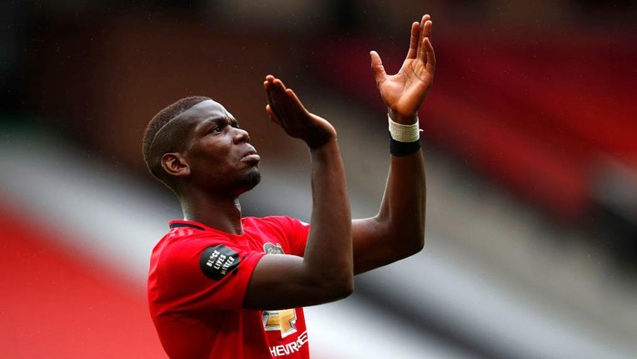 MANCHESTER, ENGLAND - JULY 04: Paul Pogba of Manchester United reacts during the Premier League match between Manchester United and AFC Bournemouth  at Old Trafford on July 04, 2020 in Manchester, England. Football Stadiums around Europe remain empty due to the Coronavirus Pandemic as Government social distancing laws prohibit fans inside venues resulting in all fixtures being played behind closed doors. (Photo by Clive Brunskill/Getty Images)