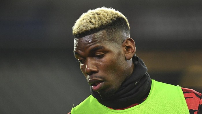 Manchester Uniteds Paul Pogba before the English Premier League soccer match between West Ham United and Manchester United at the London stadium in London, England, Saturday, Dec. 5, 2020. (Justin Setterfield/Pool Via AP)