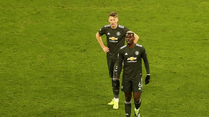 Manchester Uniteds Paul Pogba leaves the field after the Champions League group H soccer match between RB Leipzig and Manchester United at the RB Arena in Leipzig, Germany, Tuesday, Dec. 8, 2020. (AP Photo/Matthias Schrader)