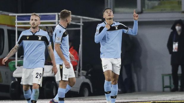 Lazio's Joaquin Correa celebrates after scoring his side's opening goal during the Champions League, group F soccer match between Lazio and Club Brugge, at the Rome Olympic Stadium, Tuesday, Dec. 8, 2020. (AP Photo/Andrew Medichini)