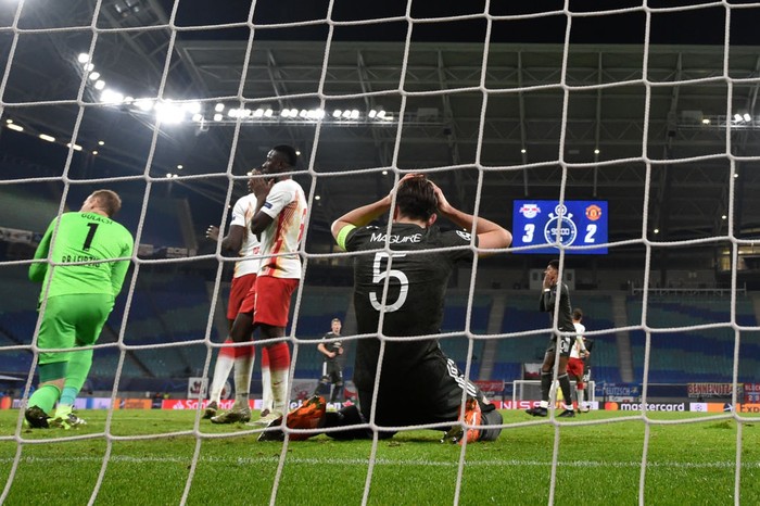 LEIPZIG, GERMANY - DECEMBER 08: Harry Maguire of Manchester United reacts after missing a goal scoring chance during the UEFA Champions League Group H stage match between RB Leipzig and Manchester United at Red Bull Arena on December 08, 2020 in Leipzig, Germany. Sporting stadiums around Germany remain under strict restrictions due to the Coronavirus Pandemic as Government social distancing laws prohibit fans inside venues resulting in games being played behind closed doors. (Photo by Stuart Franklin/Getty Images)
