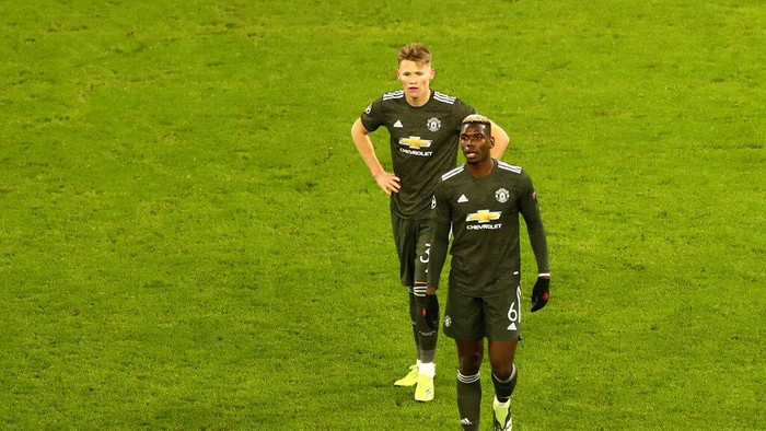 Manchester Uniteds Paul Pogba leaves the field after the Champions League group H soccer match between RB Leipzig and Manchester United at the RB Arena in Leipzig, Germany, Tuesday, Dec. 8, 2020. (AP Photo/Matthias Schrader)
