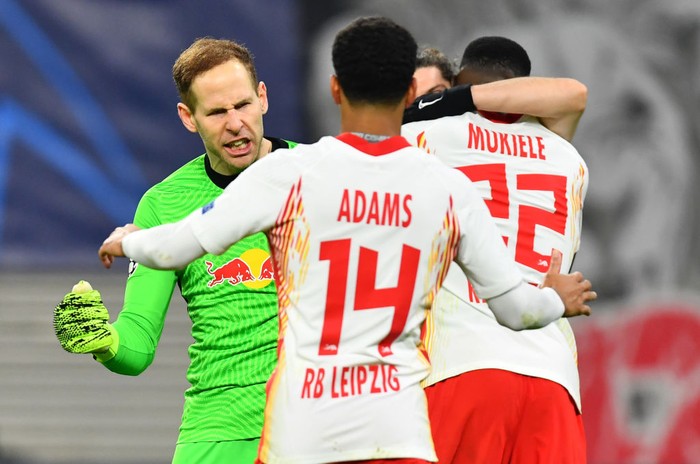 LEIPZIG, GERMANY - DECEMBER 08: Peter Gulacsi, Tyler Adams and Nordi Mukiele all of RB Leipzig celebrate following the UEFA Champions League Group H stage match between RB Leipzig and Manchester United at Red Bull Arena on December 08, 2020 in Leipzig, Germany. Sporting stadiums around Germany remain under strict restrictions due to the Coronavirus Pandemic as Government social distancing laws prohibit fans inside venues resulting in games being played behind closed doors. (Photo by Stuart Franklin/Getty Images)
