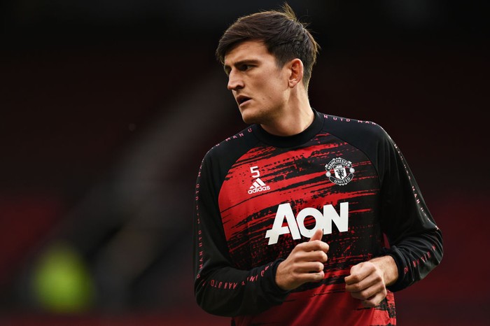 MANCHESTER, ENGLAND - OCTOBER 04: Harry Maguire of Manchester United warms up ahead of the Premier League match between Manchester United and Tottenham Hotspur at Old Trafford on October 04, 2020 in Manchester, England. Sporting stadiums around the UK remain under strict restrictions due to the Coronavirus Pandemic as Government social distancing laws prohibit fans inside venues resulting in games being played behind closed doors. (Photo by Oli Scarff - Pool/Getty Images)