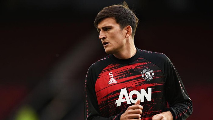 MANCHESTER, ENGLAND - OCTOBER 04: Harry Maguire of Manchester United warms up ahead of the Premier League match between Manchester United and Tottenham Hotspur at Old Trafford on October 04, 2020 in Manchester, England. Sporting stadiums around the UK remain under strict restrictions due to the Coronavirus Pandemic as Government social distancing laws prohibit fans inside venues resulting in games being played behind closed doors. (Photo by Oli Scarff - Pool/Getty Images)