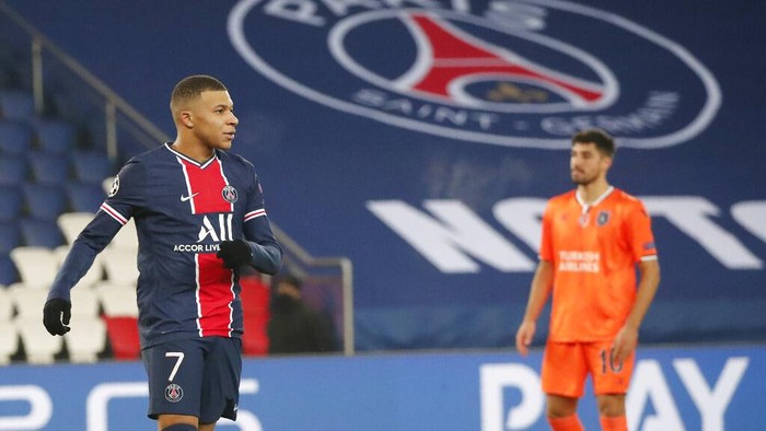 PSGs Kylian Mbappe celebrates after scoring his sides third goal during the Champions League group H soccer match between Paris Saint Germain and Istanbul Basaksehir at the Parc des Princes stadium in Paris, France, Wednesday, Dec. 9, 2020. (AP Photo/Francois Mori)