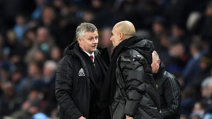 MANCHESTER, ENGLAND - DECEMBER 07: Ole Gunnar Solskjaer, Manager of Manchester United speaks with Pep Guardiola, Manager of Manchester City during the Premier League match between Manchester City and Manchester United at Etihad Stadium on December 07, 2019 in Manchester, United Kingdom. (Photo by Michael Regan/Getty Images)