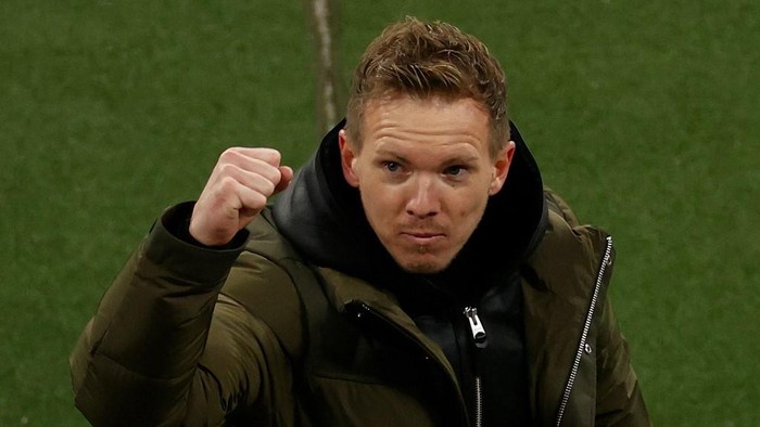 Leipzigs German headcoach Julian Nagelsmann celebrates after the UEFA Champions League Group H football match RB Leipzig v Manchester United in Leipzig, eastern Germany, on December 8, 2020. (Photo by Odd ANDERSEN / various sources / AFP)