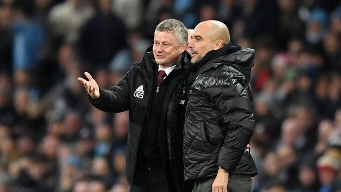 MANCHESTER, ENGLAND - DECEMBER 07: Ole Gunnar Solskjaer, Manager of Manchester United speaks with Pep Guardiola, Manager of Manchester City during the Premier League match between Manchester City and Manchester United at Etihad Stadium on December 07, 2019 in Manchester, United Kingdom. (Photo by Michael Regan/Getty Images)