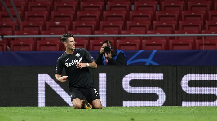 MADRID, SPAIN - OCTOBER 27: Dominik Szoboszlai of RB Salzburg  celebrates after scoring his teams first goal  during the UEFA Champions League Group A stage match between Atletico Madrid and RB Salzburg at Estadio Wanda Metropolitano on October 27, 2020 in Madrid, Spain. Football Stadiums around Europe remain empty due to the Coronavirus Pandemic as Government social distancing laws prohibit fans inside venues resulting in fixtures being played behind closed doors. (Photo by Angel Martinez/Getty Images)