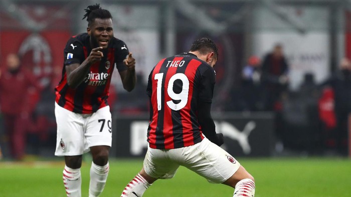 MILAN, ITALY - DECEMBER 13: Theo Hernandez of A.C. Milan celebrates after scoring their teams second goal with teammate Franck Kessie during the Serie A match between AC Milan and Parma Calcio at Stadio Giuseppe Meazza on December 13, 2020 in Milan, Italy. Sporting stadiums around Italy remain under strict restrictions due to the Coronavirus Pandemic as Government social distancing laws prohibit fans inside venues resulting in games being played behind closed doors. (Photo by Marco Luzzani/Getty Images)