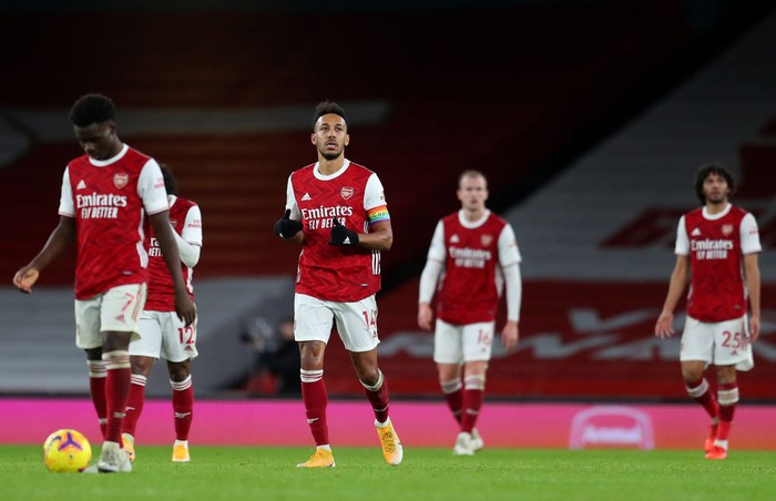 Arsenal LONDON, ENGLAND - DECEMBER 13: Pierre-Emerick Aubameyang of Arsenal reacts after scoring an own goal during the Premier League match between Arsenal and Burnley at Emirates Stadium on December 13, 2020 in London, England. A limited number of spectators (2000) are welcomed back to stadiums to watch elite football across England. This was following easing of restrictions on spectators in tiers one and two areas only. (Photo by Catherine Ivill/Getty Images )