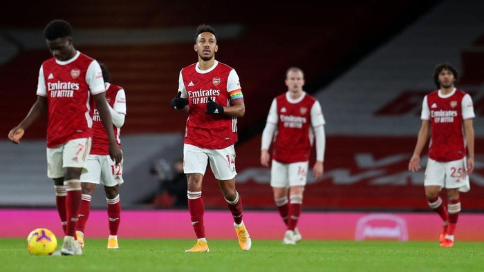 LONDON, ENGLAND - DECEMBER 13: Pierre-Emerick Aubameyang of Arsenal reacts after scoring an own goal during the Premier League match between Arsenal and Burnley at Emirates Stadium on December 13, 2020 in London, England. A limited number of spectators (2000) are welcomed back to stadiums to watch elite football across England. This was following easing of restrictions on spectators in tiers one and two areas only. (Photo by Catherine Ivill/Getty Images )