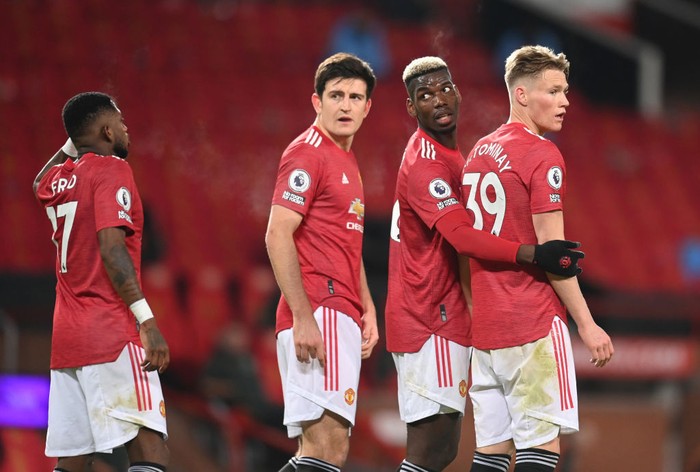 MANCHESTER, ENGLAND - DECEMBER 12: (L-R) Fred, Harry Maguire, Paul Pogba and Scott McTominay of Manchester United stand in a wall as they defend a free kick during the Premier League match between Manchester United and Manchester City at Old Trafford on December 12, 2020 in Manchester, England. The match will be played without fans, behind closed doors as a Covid-19 precaution. (Photo by Michael Regan/Getty Images)