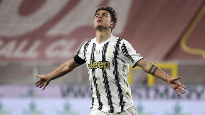 Juventus Paulo Dybala celebrates scoring during the Italian Serie A soccer match between Genoa and Juventus, at the Luigi Ferraris stadium in Genoa, Italy, Sunday, Dec. 13, 2020. (Tano Pecoraro/LaPresse via AP)