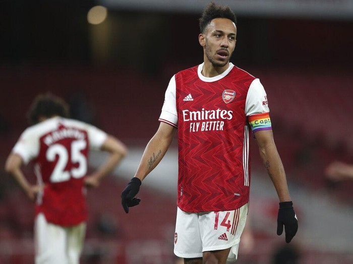 The ball skims off the head of Arsenal's Pierre-Emerick Aubameyang, 2nd right for an own-goal during an English Premier League soccer match between Arsenal and Burnley at the Emirates stadium in London, England, Sunday Dec. 13, 2020. (Nick Potts/Pool via AP)