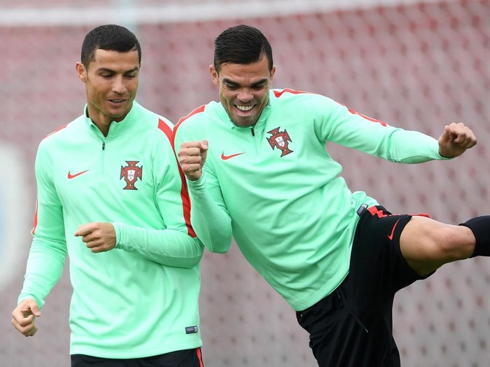 KAZAN, RUSSIA - JUNE 27: Cristiano Ronaldo of Portugal shares a joke with Pepe during a training session at Stadium Rubin on June 27, 2017 in Kazan, Russia.  (Photo by Laurence Griffiths/Getty Images)