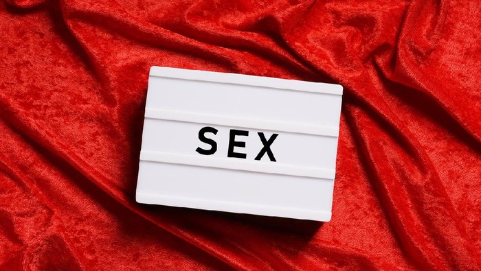 Seks sex or sexuality abstract concept without people, word on lightbox or light box sign on red velvet background