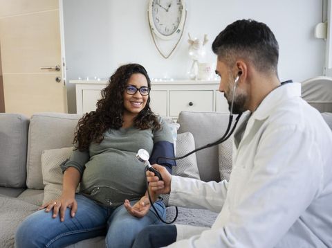 Doctor visit pregnant woman at home