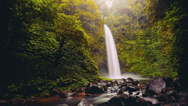 Air Terjun Nungnung Nungnung Waterfall Splashing in Bali Jungle, Indonesia